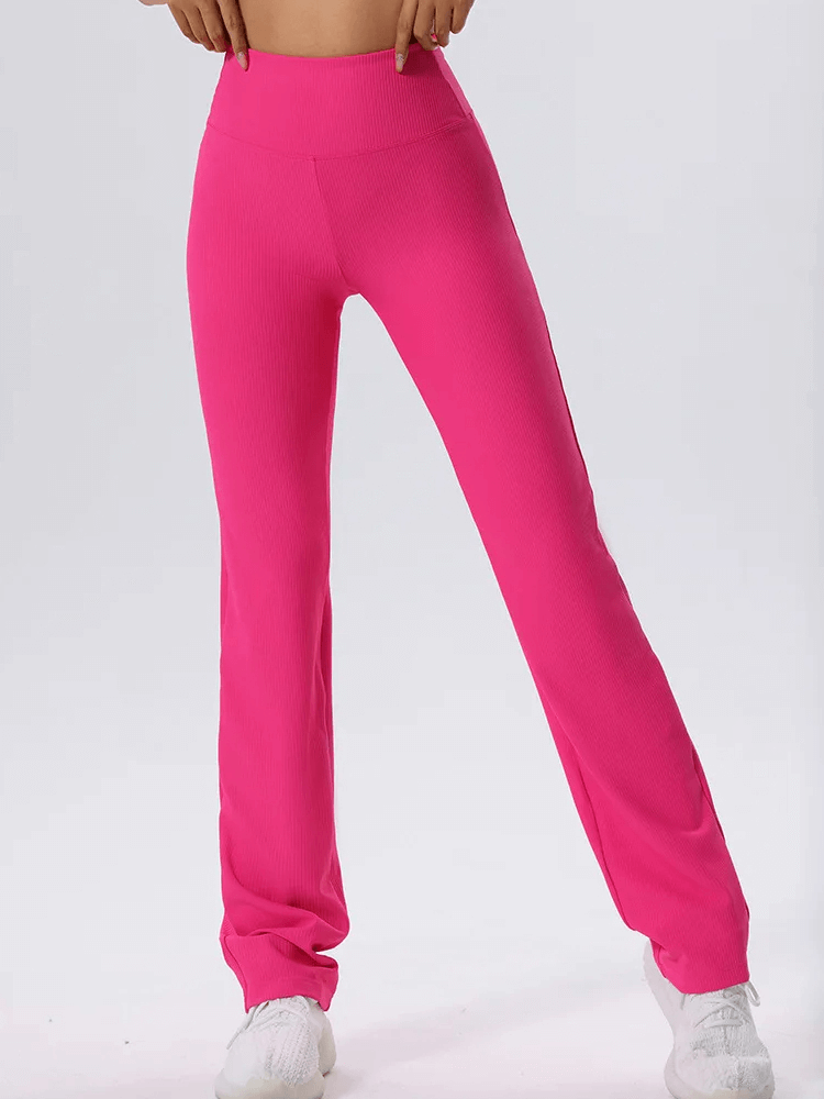 Vibrant solid color ribbed pink yoga leggings, SF2102, ideal for flexibility and movement, with an elastic waist and knitted fabric.